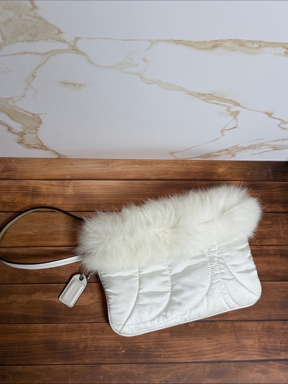 Coach Cream Quilted Wristlet with rabbit hair trim